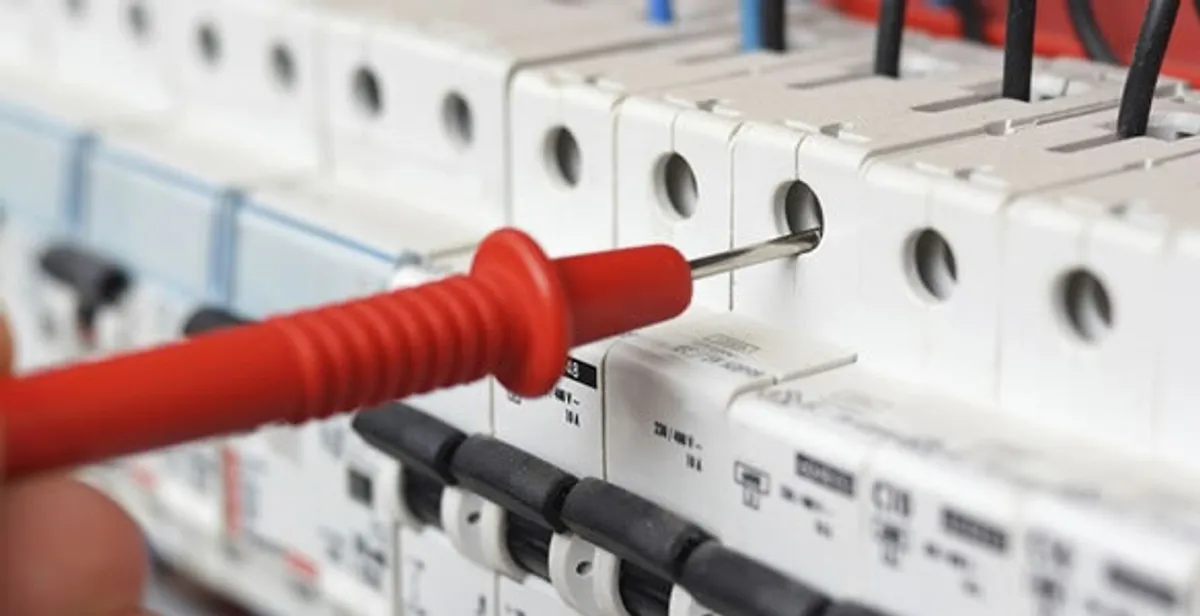 Electrical contractor testing circuit breakers during electrical repair in Denmark, WI